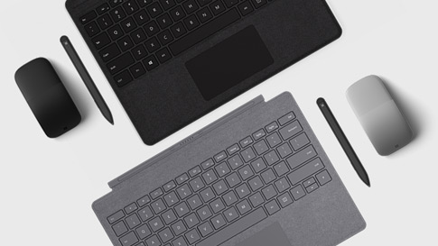Nahaufnahme von Surface Pen und Surface Dial mit Surface Pro
