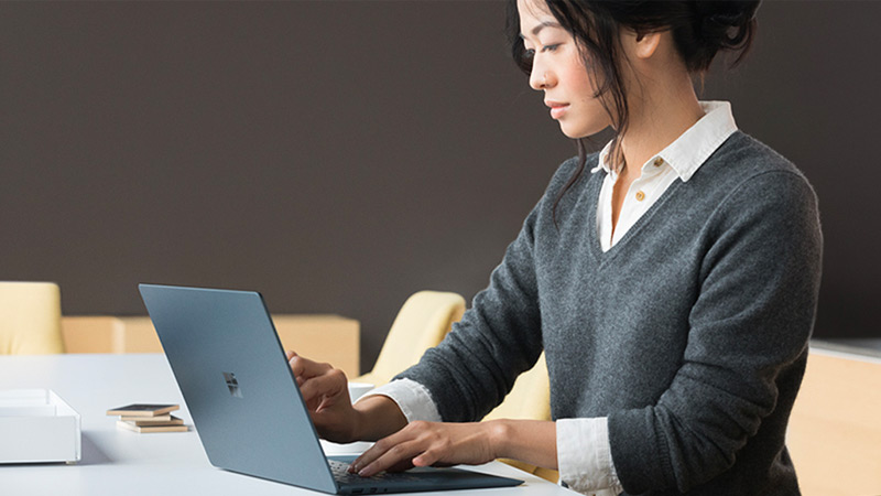 Woman working on a Surface Laptop