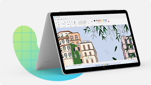 Laptop folded open with illustrated buildings