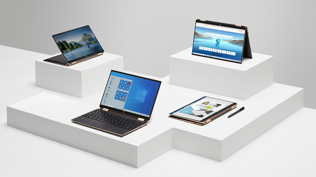 Different Windows 10 laptops on white pedestal displays