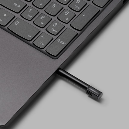Digital pen ejecting from housing on side of keyboard