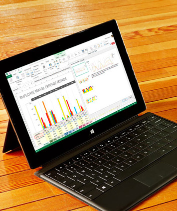 A laptop showing an Excel spreadsheet with two charts illustrating data patterns.
