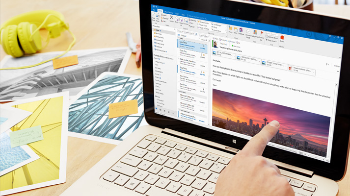 A laptop showing a preview of an Office 365 email with custom formatting and an image.