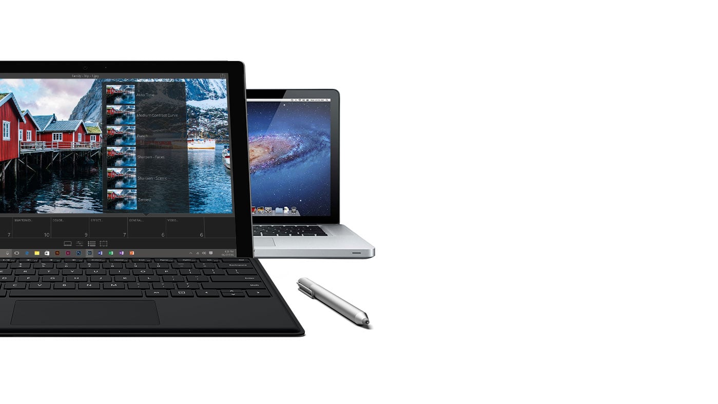 Surface Pro 4 with black keyboard facing front with a Surface Pen next to it and a MacBook Pro peeking out from behind